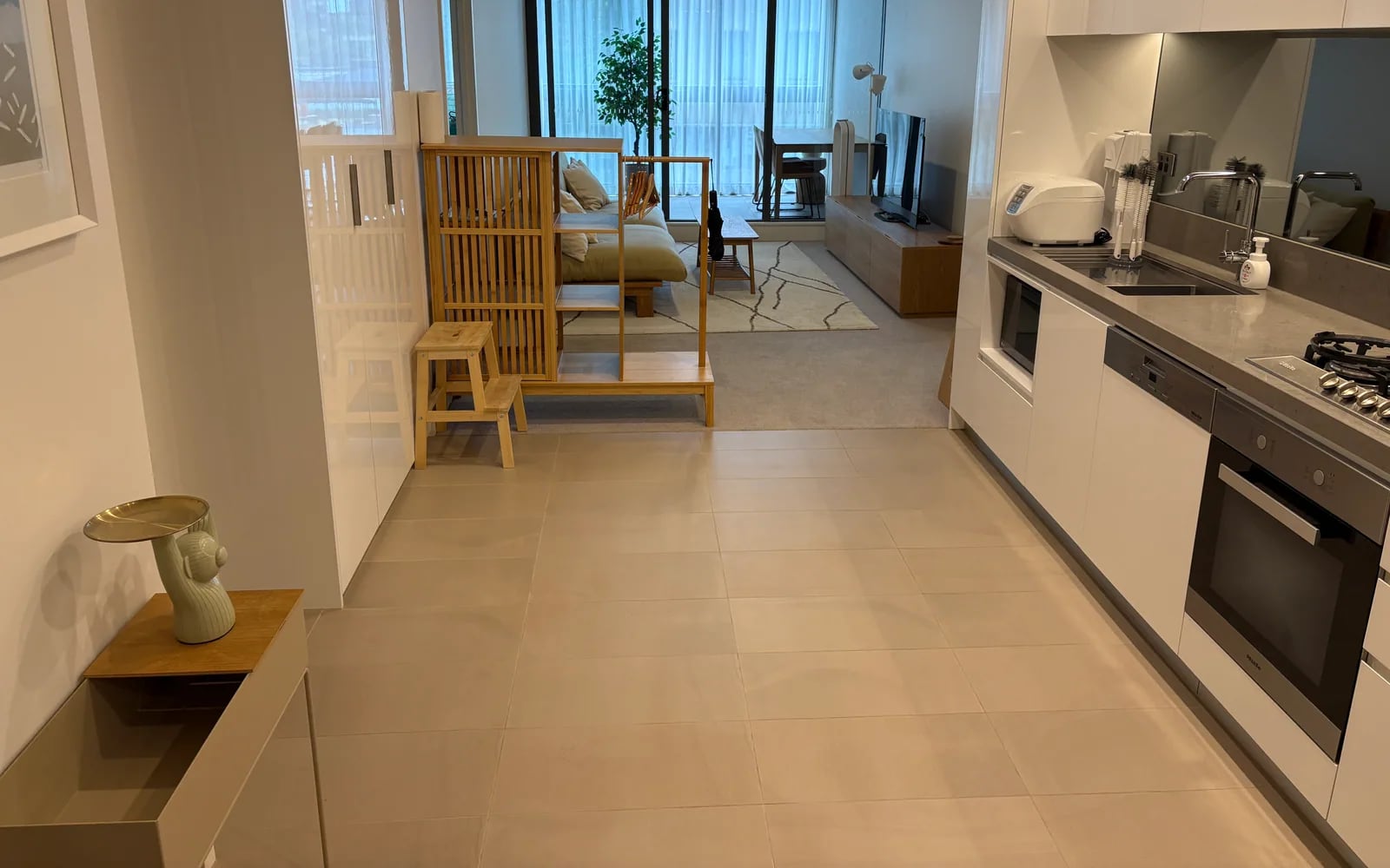 Clean open-plan kitchen and living area after OMAKASE Team Care
